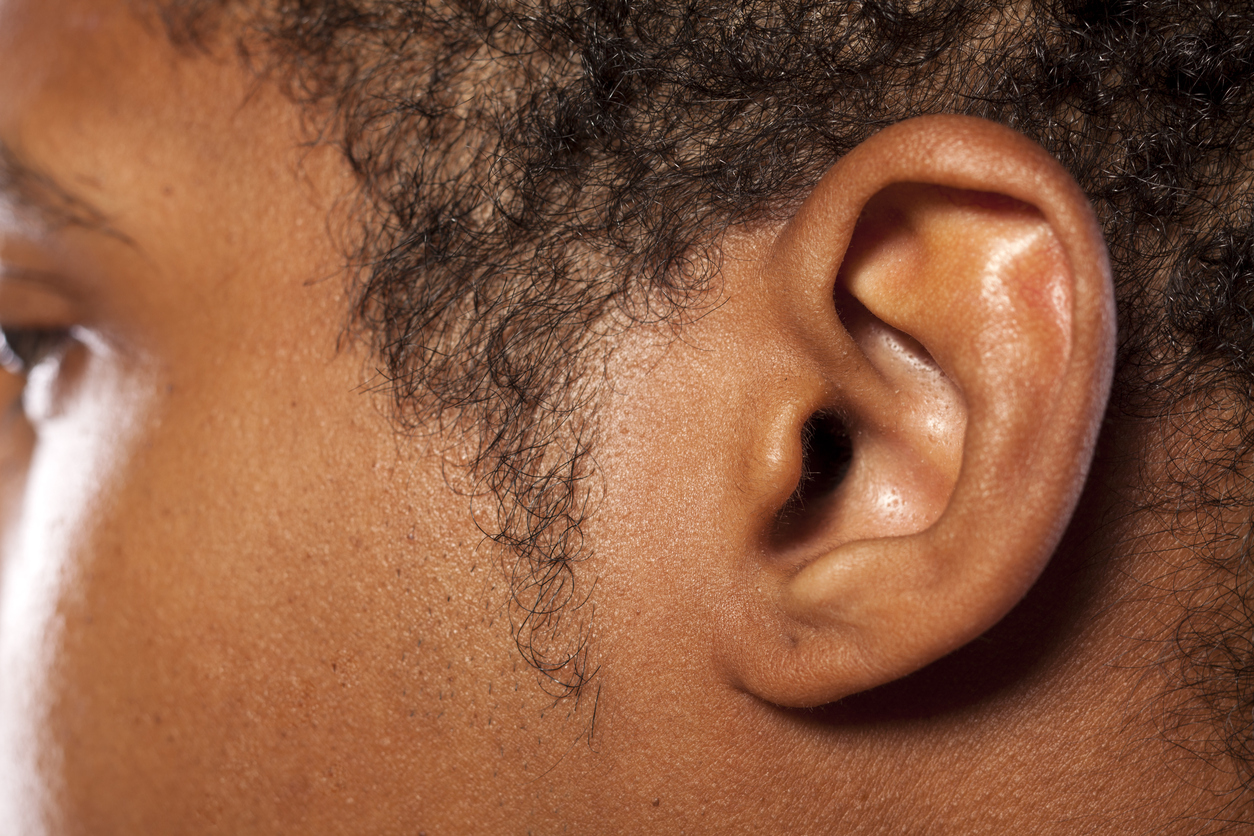 Ear of a dark-skinned young man